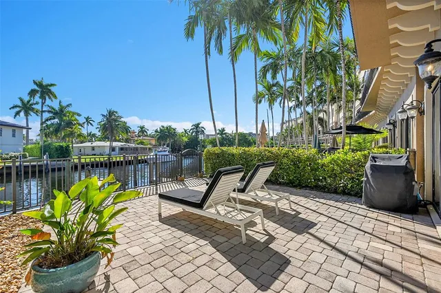 a view of a patio with couches table and chairs