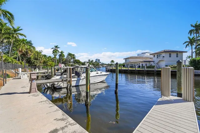 an aerial view of residential houses with outdoor space and swimming pool