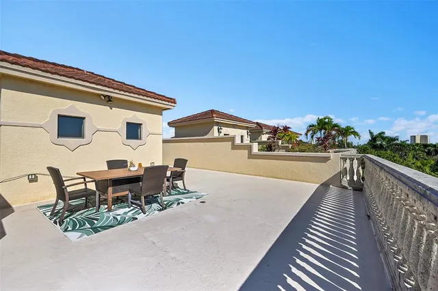 an aerial view of lake and residential houses with outdoor space
