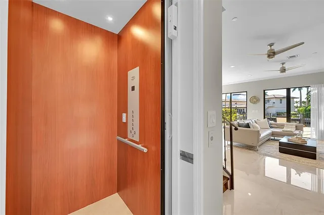 a kitchen with white cabinets and sink
