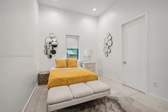 a spacious bedroom with a bed and a couch