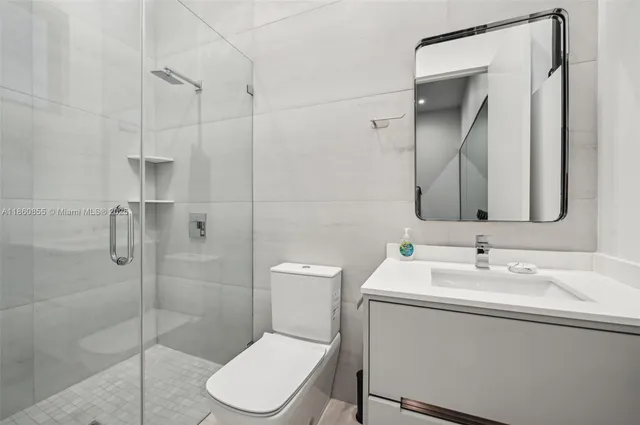 a spacious bedroom with a large bed and a large window