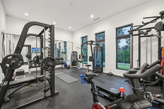 a view of a swimming pool with a yard