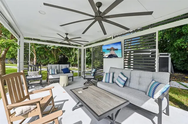 a swimming pool with outdoor seating and yard