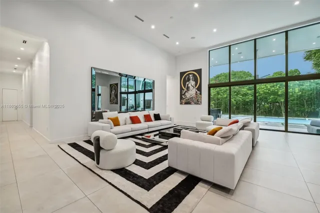 a kitchen with a sink and chairs