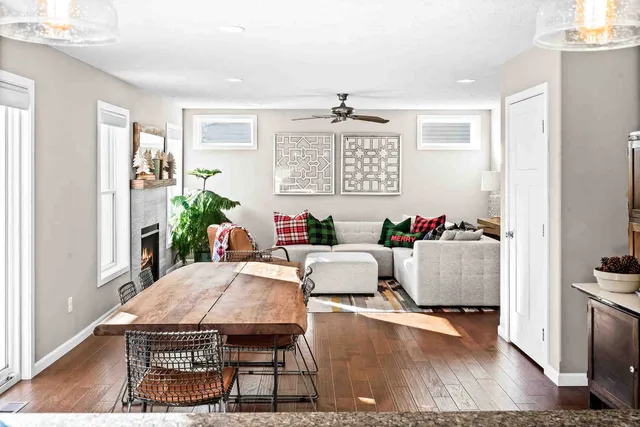 a dining room with furniture and wooden floor
