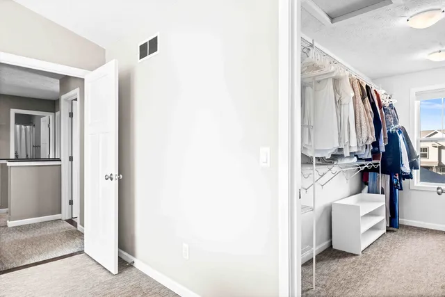 a view of living room with furniture and white walls