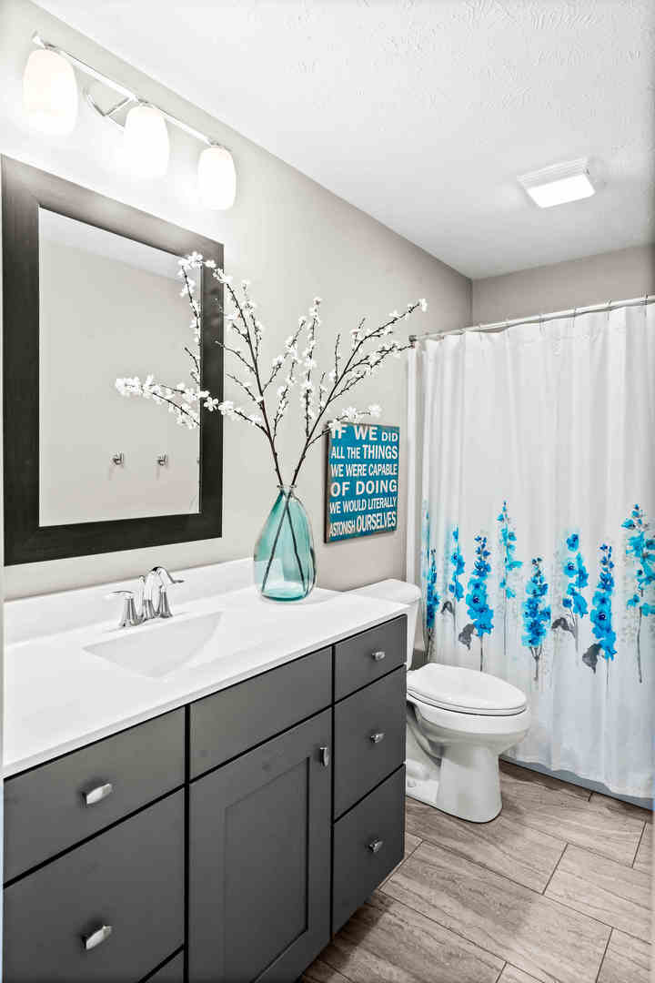 3615 Silverado Trail Normal, IL 61761 - Photo 25 of 37 a bathroom with a toilet sink and mirror