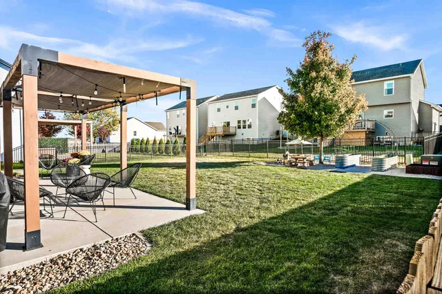 an aerial view of a house with swimming pool garden and patio