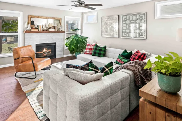 a living room with furniture and a fireplace