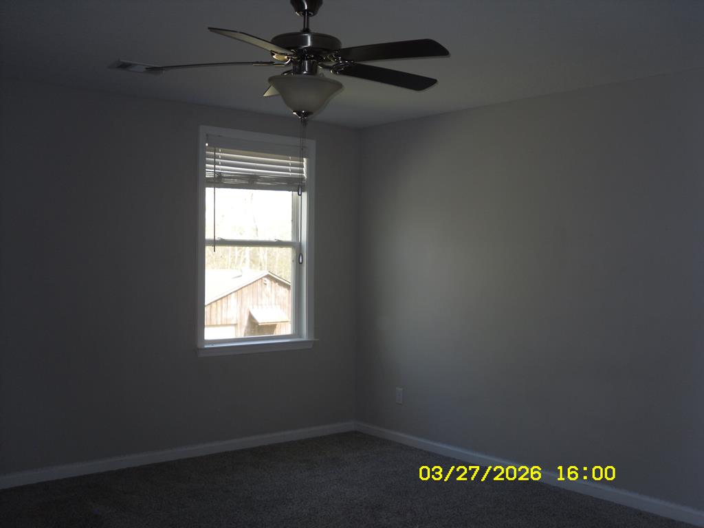 1325 Hawkins Road Woodland, GA 31836 - Photo 12 of 22 an empty room with a window
