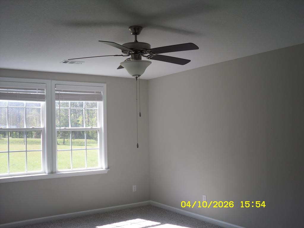 1325 Hawkins Road Woodland, GA 31836 - Photo 17 of 22 a view of an empty room with a window