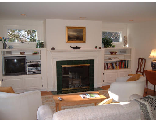 7 Radcliffe Road Wellesley, MA 02482 - Photo 6 of 11 a living room with furniture a flat screen tv and a fireplace
