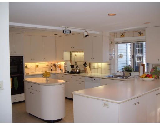 7 Radcliffe Road Wellesley, MA 02482 - Photo 7 of 11 a kitchen with sink cabinets and living room