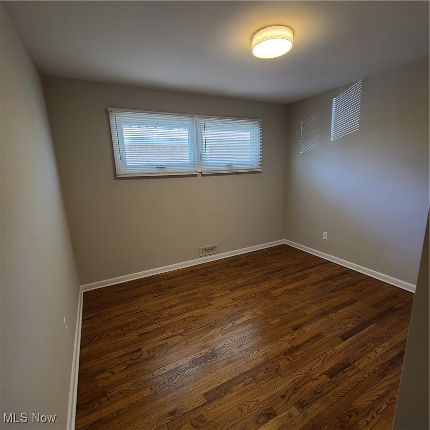 12204 Grannis Road Garfield Heights, OH 44125 - Photo 12 of 22 Bedroom #3 was freshly repainted and has refinished hardwood flooring
