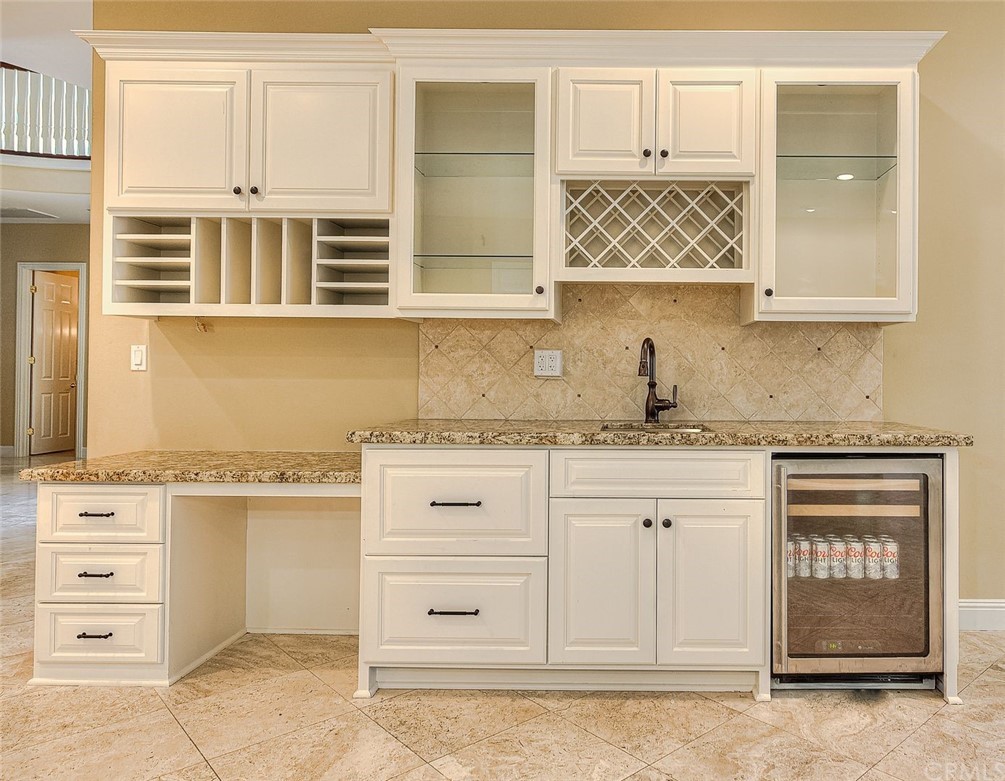 16 Bent Oak Coto de Caza, CA 92679 - Photo 27 of 56 a kitchen with granite countertop white cabinets and stainless steel appliances