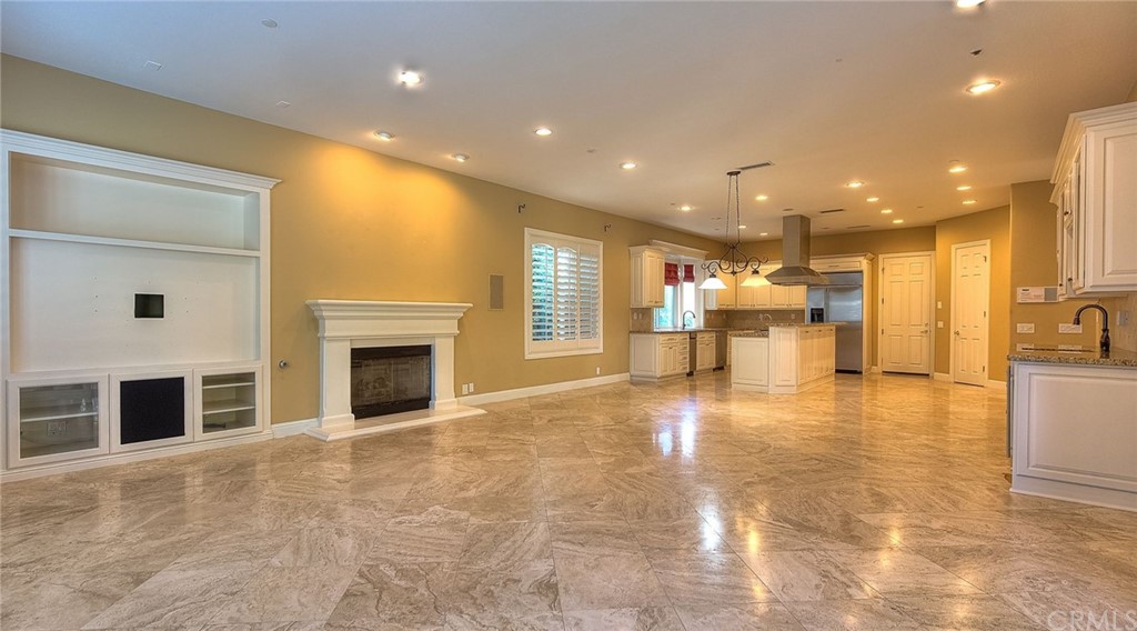 16 Bent Oak Coto de Caza, CA 92679 - Photo 30 of 56 a view of a kitchen with a sink and a fireplace