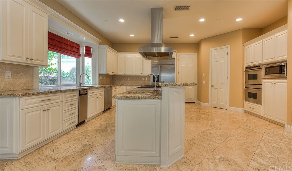 16 Bent Oak Coto de Caza, CA 92679 - Photo 37 of 56 a kitchen with stainless steel appliances granite countertop a refrigerator and a stove top oven