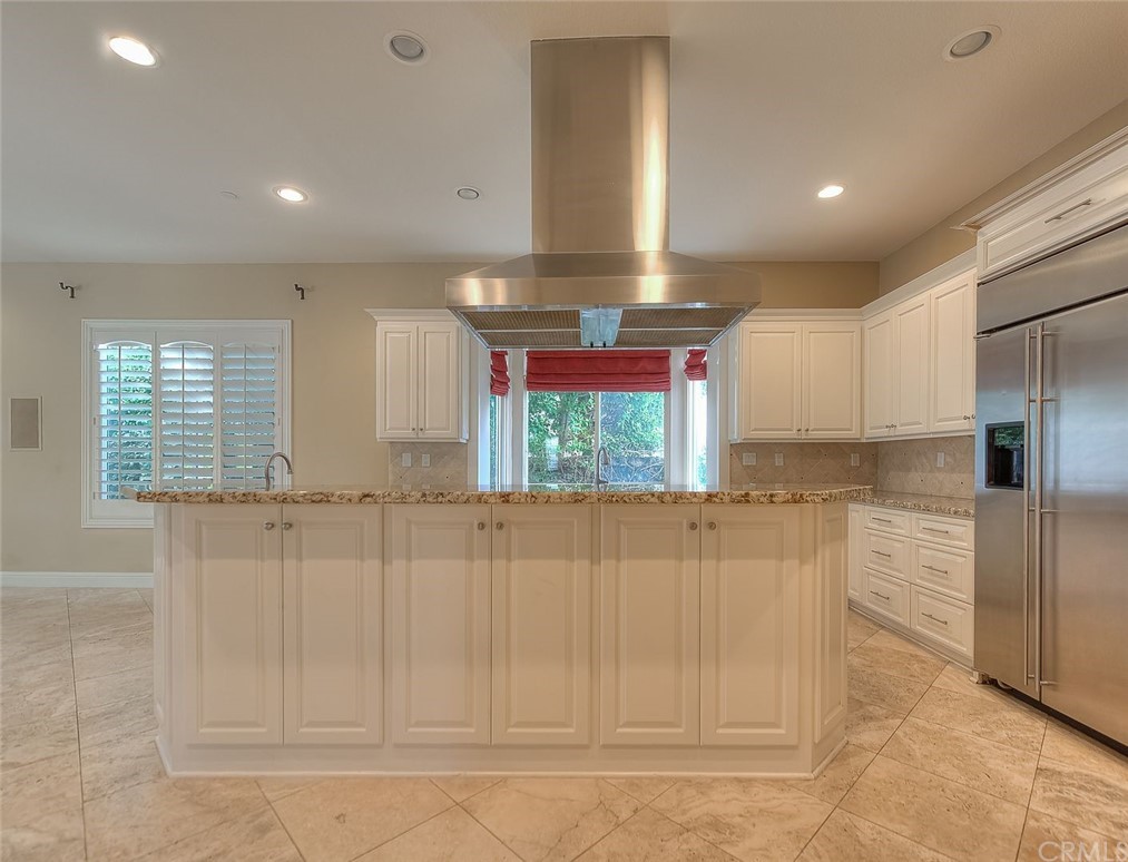 16 Bent Oak Coto de Caza, CA 92679 - Photo 41 of 56 a kitchen with white cabinets and window