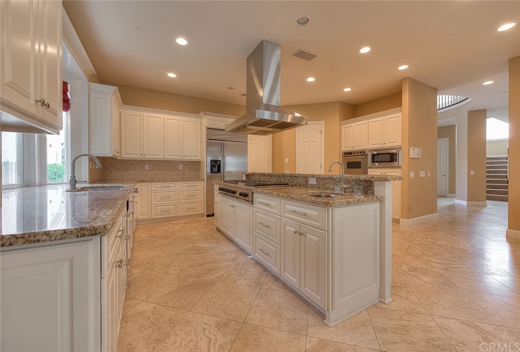 16 Bent Oak Coto de Caza, CA 92679 - Photo 46 of 56 a large kitchen with stainless steel appliances kitchen island granite countertop a large counter top and a stove