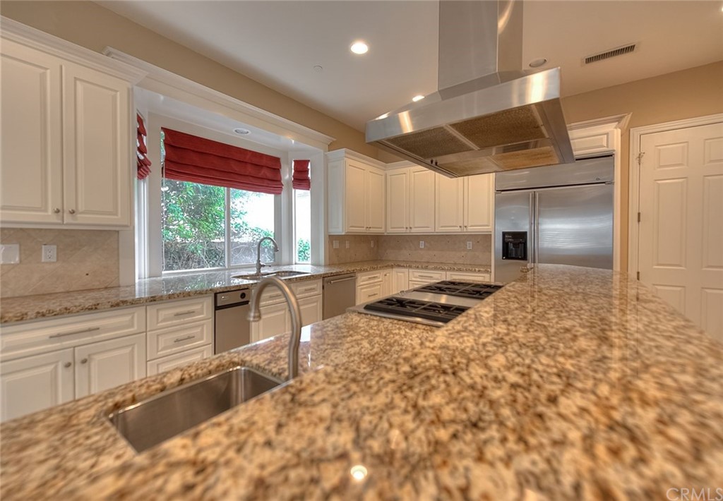 16 Bent Oak Coto de Caza, CA 92679 - Photo 47 of 56 a kitchen with a stove a sink and a refrigerator