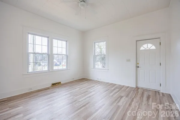 a view of room with window and hardwood floor