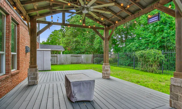a view of small yard with a small deck