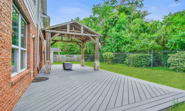 a view of a deck with couches and wooden floor