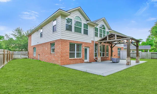 a front view of a house with a yard and porch
