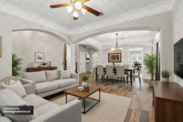 a living room with furniture a dining table and a chandelier