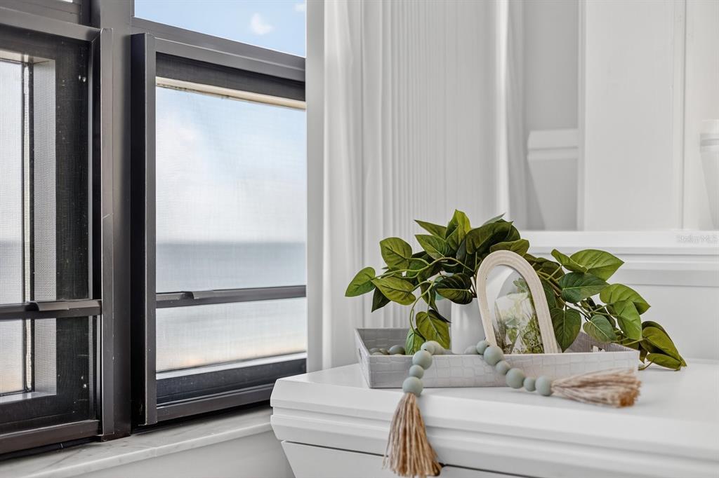 415 L L Ambiance Drive, Unit C403 Longboat Key, FL 34228 - Photo 19 of 81 a bathroom with a potted plant