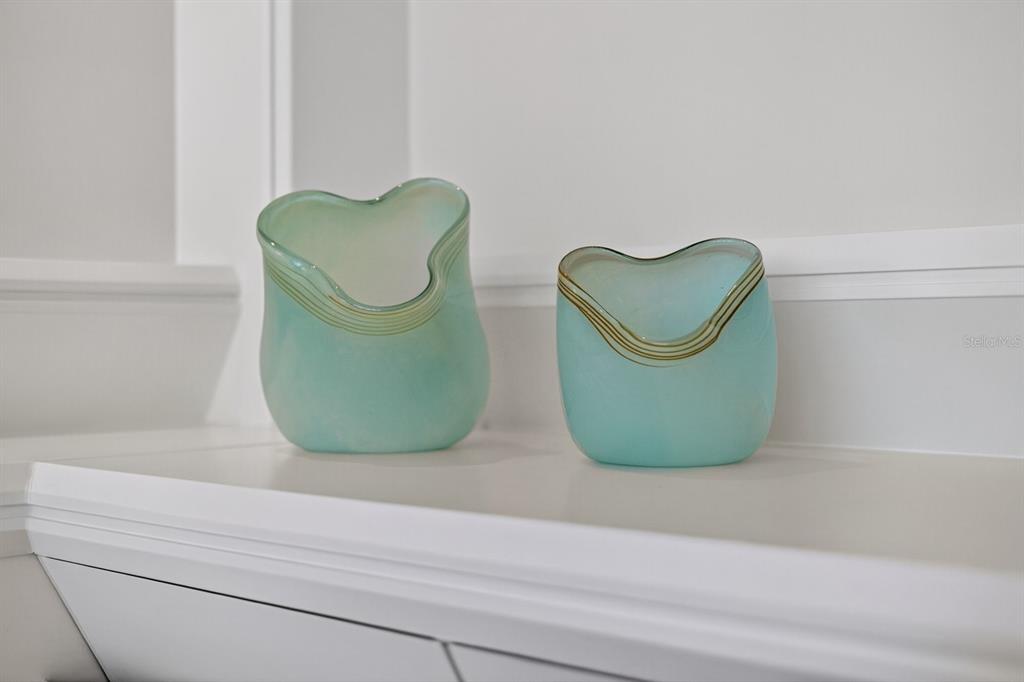 415 L L Ambiance Drive, Unit C403 Longboat Key, FL 34228 - Photo 20 of 81 a view of two mirror and a vase of flowers