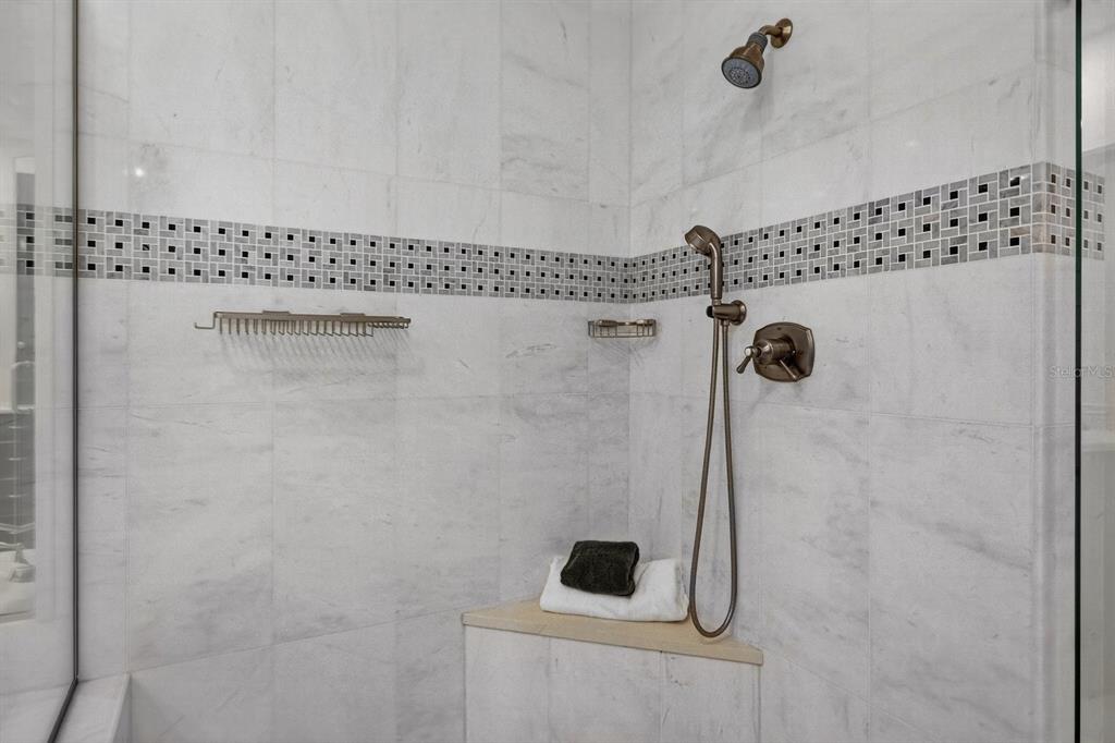 415 L L Ambiance Drive, Unit C403 Longboat Key, FL 34228 - Photo 23 of 81 a bathroom with a shower