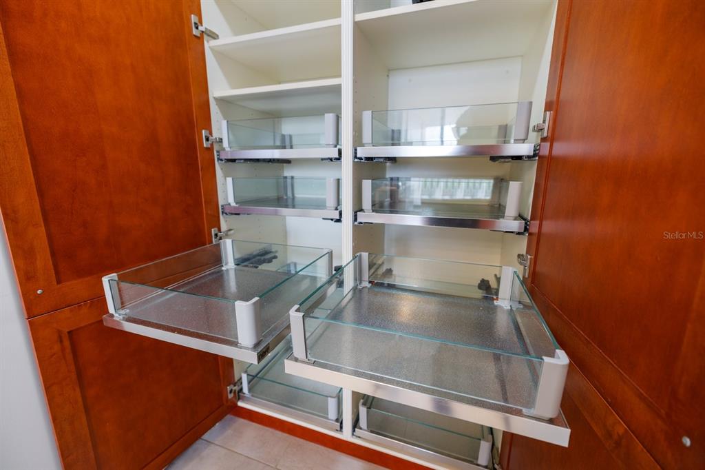 415 L L Ambiance Drive, Unit C403 Longboat Key, FL 34228 - Photo 41 of 81 a kitchen with kitchen island a sink stove and refrigerator