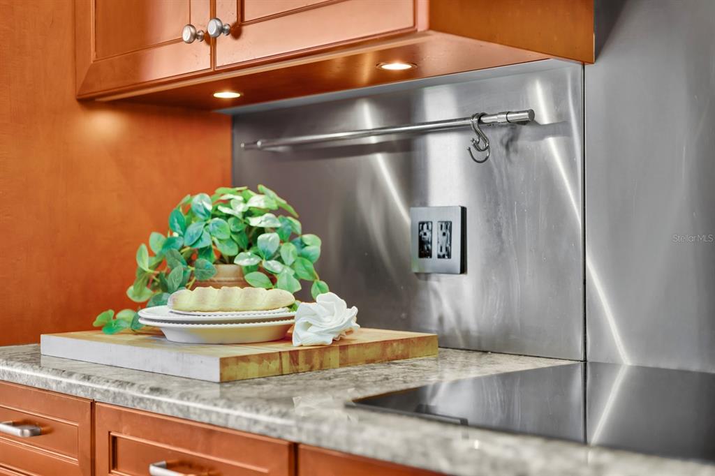 415 L L Ambiance Drive, Unit C403 Longboat Key, FL 34228 - Photo 43 of 81 a kitchen with a refrigerator and a stove