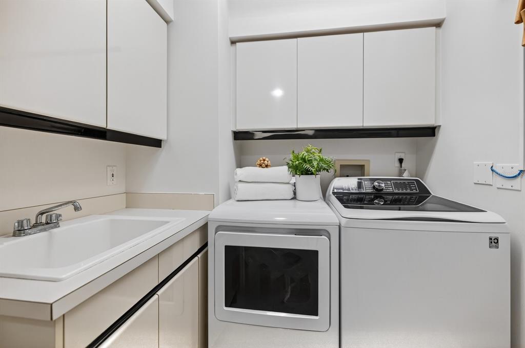 415 L L Ambiance Drive, Unit C403 Longboat Key, FL 34228 - Photo 46 of 81 a kitchen with a sink cabinets and appliances