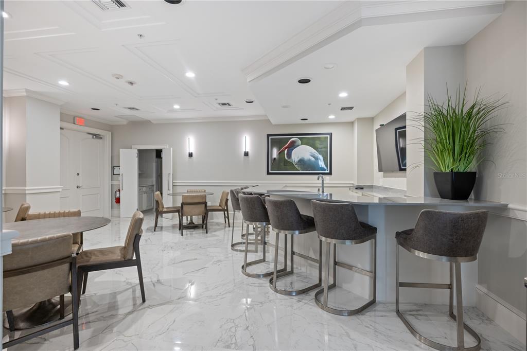 415 L L Ambiance Drive, Unit C403 Longboat Key, FL 34228 - Photo 50 of 81 a living room with furniture and a large window