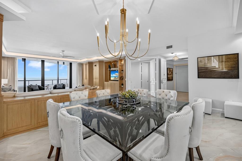 415 L L Ambiance Drive, Unit C403 Longboat Key, FL 34228 - Photo 5 of 81 a dinning area with furniture kitchen view and a large window