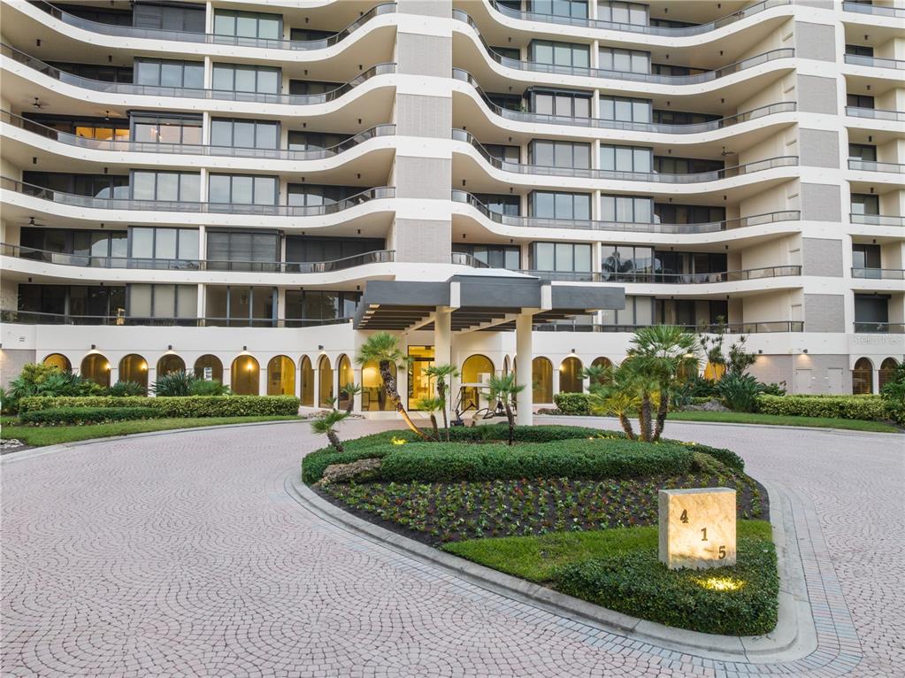 415 L L Ambiance Drive, Unit C403 Longboat Key, FL 34228 - Photo 60 of 81 a front view of building with yard