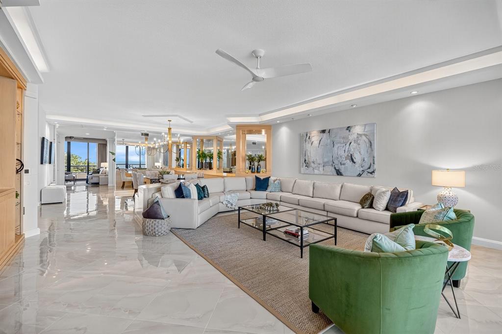 415 L L Ambiance Drive, Unit C403 Longboat Key, FL 34228 - Photo 8 of 81 a living room with furniture and a wooden floor