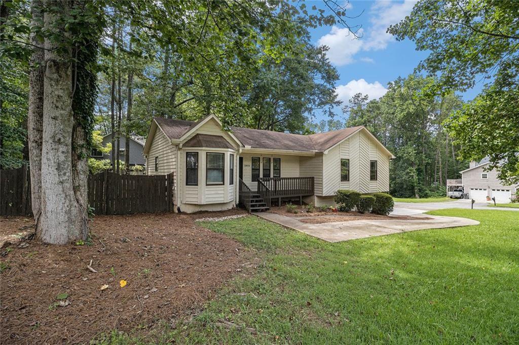 647 Sunshine Trace Northwest Acworth, GA 30102 - Photo 1 of 1 a front view of a house with patio and garden