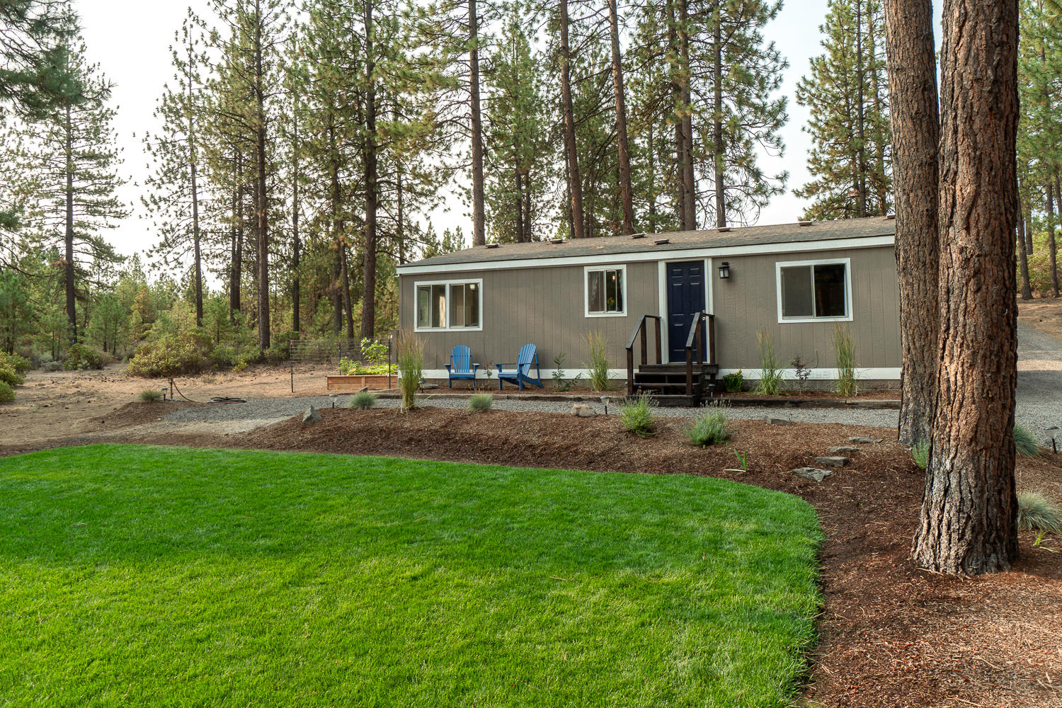 19197 Kiowa Road Bend, OR 97702 - Photo 2 of 32 a backyard of a house with yard table and chairs