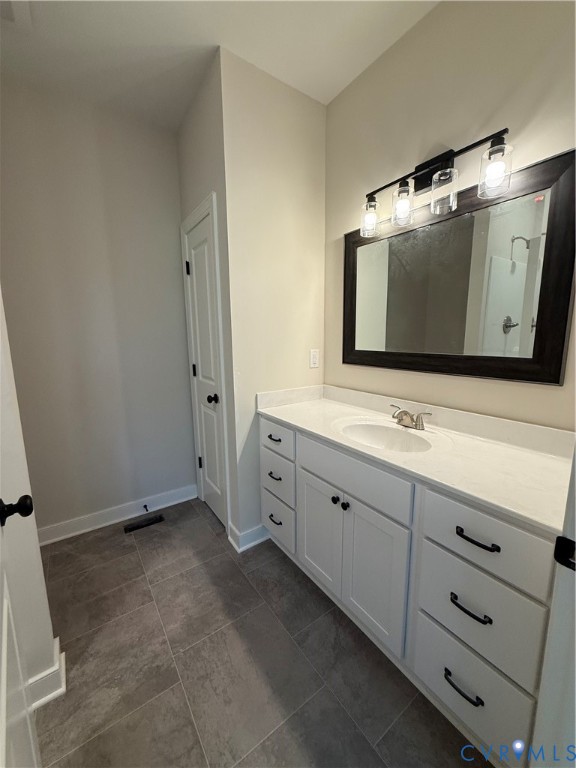 20545 Braxton Road Barhamsville, VA 23011 - Photo 16 of 22 a bathroom with double sink and mirror