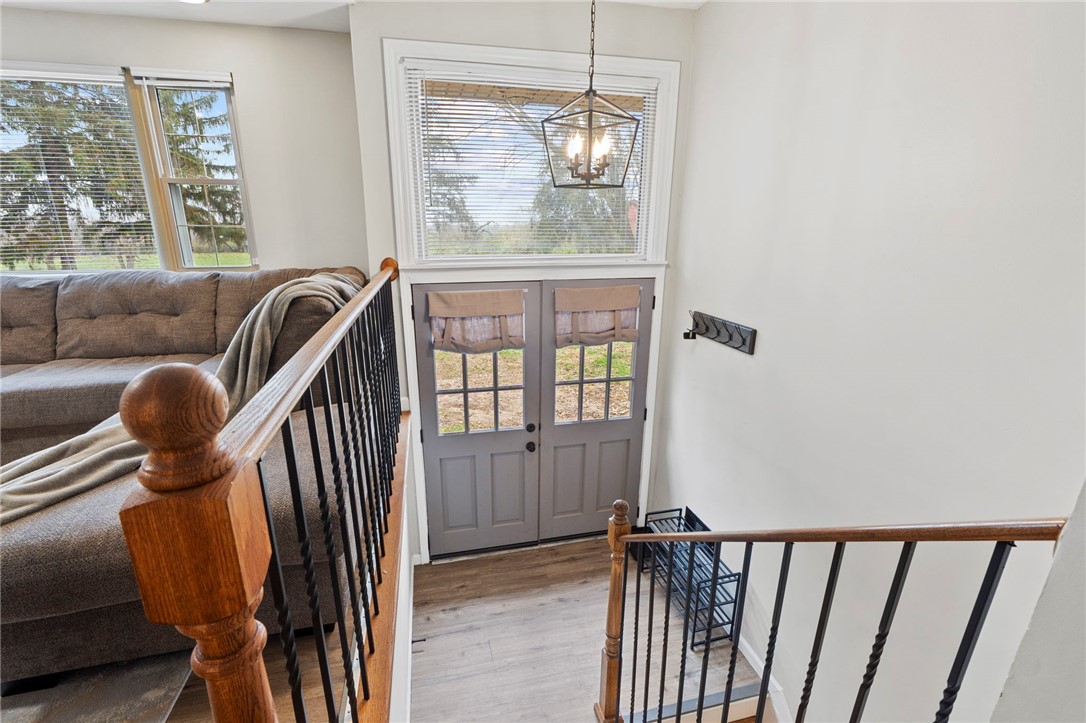 8180 Manning Road Germantown, OH 45327 - Photo 2 of 39 This inviting entryway features a beautiful door and stairway with natural light.