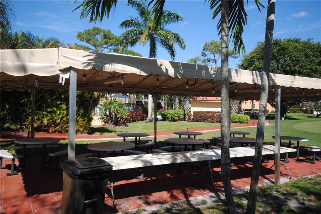 1997 Southwest Palm City Road, Unit I Stuart, FL 34994 - Photo 30 of 36 Covered Picnic area next to the Barbeque grill