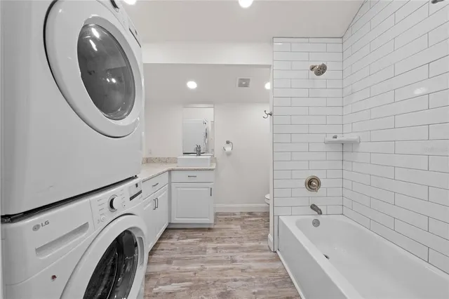 a bathroom with a sink a toilet and bathtub