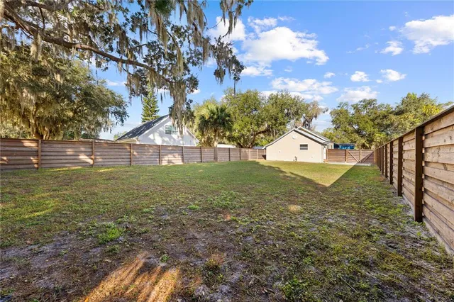 a view of outdoor space with deck and yard
