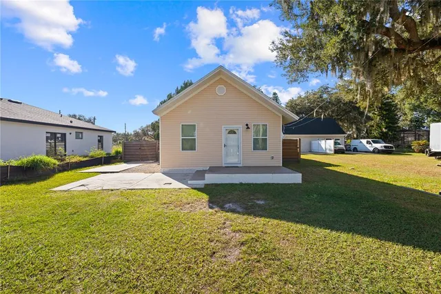 a house view with swimming pool and yard
