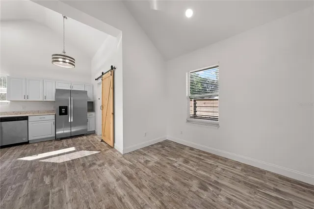 a view of a kitchen with a sink and dishwasher cabinets