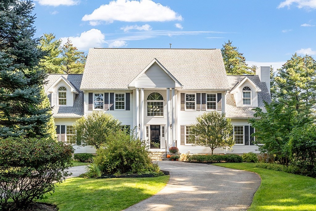 83 Weldon Farm Road Rowley, MA 01969 - Photo 1 of 41 a front view of a house with a yard